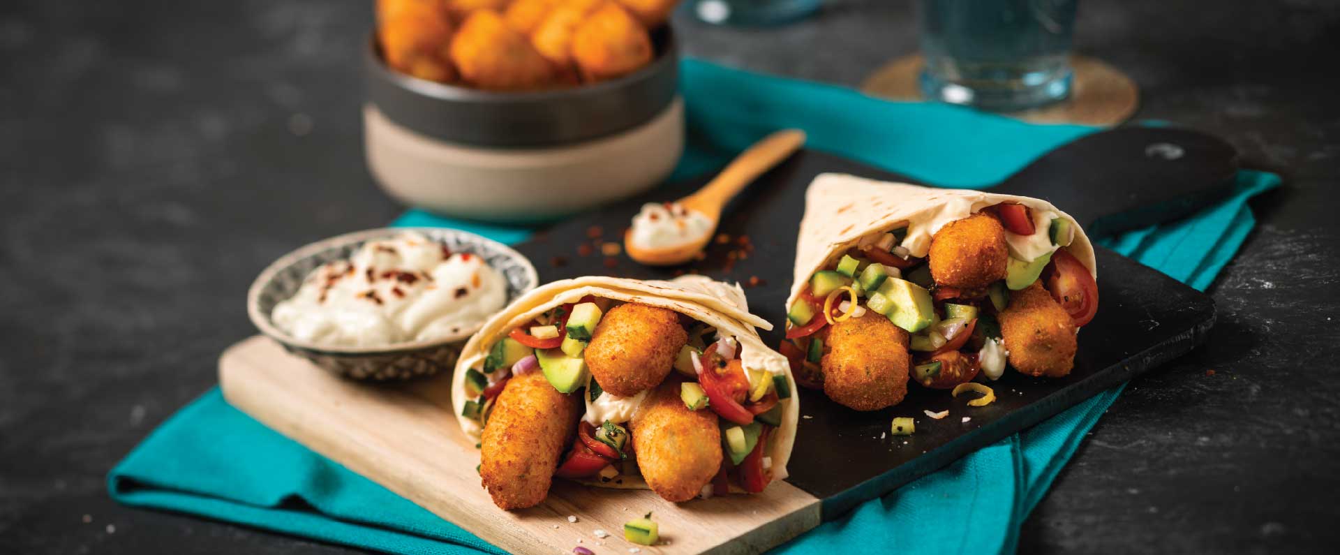 Wrap Filled With McCain Crispy Veggie Fingers, Sour Cream, Avo And Tomato Salsa